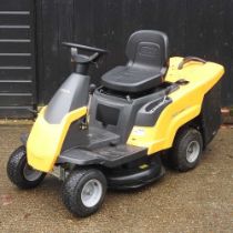 A Stiga yellow Combi 1066 HQ petrol ride-on lawnmower Looks to be quite new with only very light
