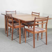 A 1960's G Plan teak dining suite, comprising an extending dining table and four chairs (5) 192w x