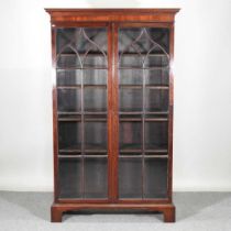 A 19th century mahogany astragal glazed standing bookcase, on bracket feet 116w x 43d x 188h cm