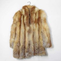 A 1980's ladies fox red fur coat, approximately size 12 Overall condition looks to be undamaged