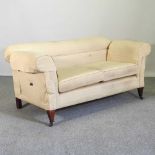 An Edwardian yellow upholstered drop end chesterfield sofa, on tapered legs 166w x 79d x 73h cm
