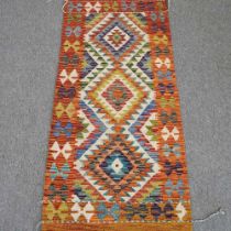 A kilim runner, with three central diamonds, 146 x 67cm