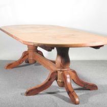 An unusually large hand made pine twin pedestal dining table, on splayed legs 3120w x 122d x 79h cm