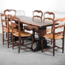 A set of six early 20th century French ladderback dining chairs, with rush seats, together with an