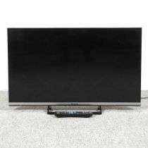 A Panasonic thirty-two inch flat screen television, with remote control