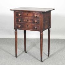 A 19th century mahogany side table, containing three drawers, on reeded legs 58w x 37d x 75h cm