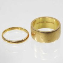 An 18 carat gold wedding band, 11g, size P, 9mm deep, together with a 22 carat gold ring, 2.6g, size