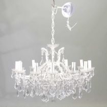 A modern twelve branch cream painted chandelier, with cut glass drops, 80cm diameter