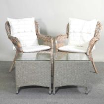 A pair of rattan armchairs, together with a pair of outdoor rattan garden tables, with glass tops (