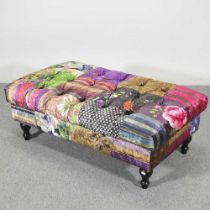 A modern upholstered footstool, on turned legs 110w x 65d x 40h cm