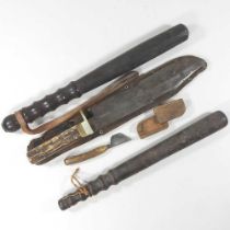 A wooden truncheon, 39cm long, together with another, an early 20th century horn handled knife and