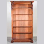 A large Victorian mahogany standing open bookcase, with carved corbels, on a plinth base 123w x