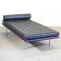 After Mies Van Der Rohe, a Barcelona day bed, with a black buttoned seat and cushion, on metal legs