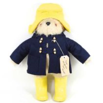 A Gabrielle Designs Paddington bear, with a yellow hat and wellington boots, 45cm high