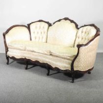 An early 20th century French cream upholstered show frame sofa, on cabriole legs 198w x 89d x 74h