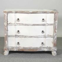 An antique style white painted chest of drawers, of serpentine shape 101w x 40d x 83h cm