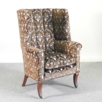 A 19th century barrel back armchair, upholstered in green floral velvet, on sabre legs 75w x 77d x