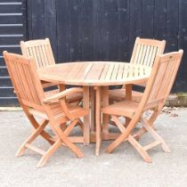 A Westminster teak circular folding garden table, together with a set of four matching chairs, to