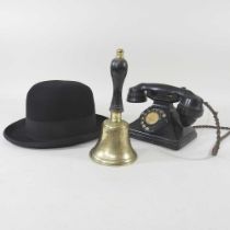 A vintage black bakelite telephone, together with a bowler hat, by Lincoln Bennett & Co, 162
