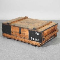 A military style wooden trunk, with a hinged lid 105w x 66d x 36h cm