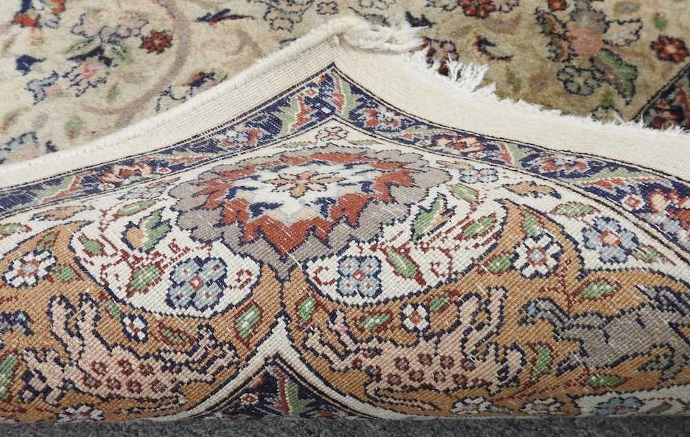 An Indian rug, with a central medallion and floral design, on a cream ground, 221 x 140cm - Image 3 of 3