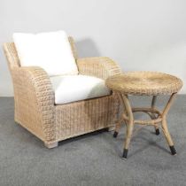 A wicker armchair, with cream cushions, together with a circular wicker occasional table, 55cm