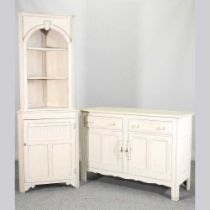 A white painted standing corner cabinet, together with a painted sideboard, 124cm wide (2) 124w x