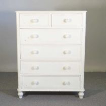 A cream painted pine chest of drawers 104w x 45d x 135h cm