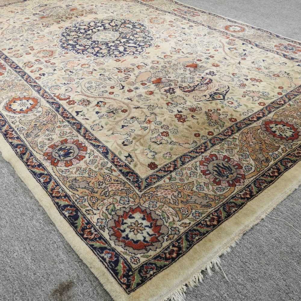 An Indian rug, with a central medallion and floral design, on a cream ground, 221 x 140cm - Image 2 of 3