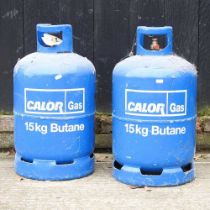 A Calor 15kg butane canister, together with another (2)