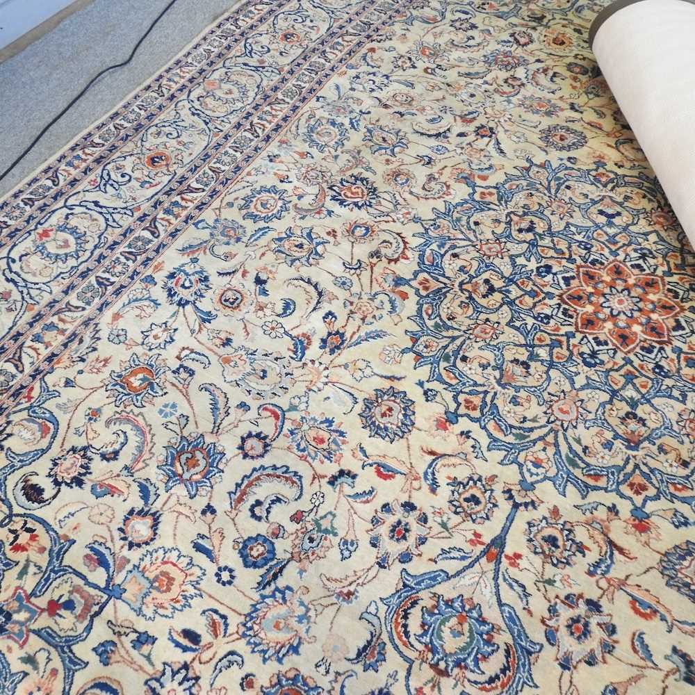 A large Persian woollen carpet, with all over foliate designs, on a cream ground, 395 x 305cm - Image 7 of 9