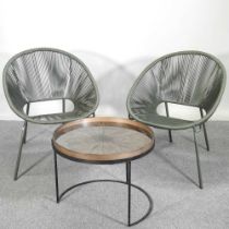A pair of woven tub shaped spaghetti chairs, together with a bronzed occasional table, with a tray