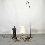 A modern standard lamp, 166cm high, together with carved table lamps and two brass wall sconces (5)
