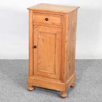 A light elm bedside cupboard, containing a single drawer 39w x 30d x 81h cm