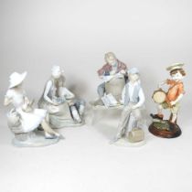 A Lladro figure of a boy and his dog, 21cm high, together with four various Nao figures and