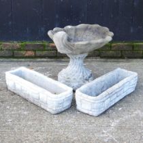 A pair of reconstituted stone garden troughs, together with a bird bath, 46cm high (3)