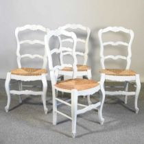 A set of four French style white painted dining chairs, with rush seats (4)