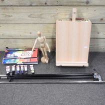 A wooden folding artist's easel, together with paints and a wooden artist's lay figure (3)