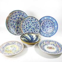 A Persian iznik tin glazed dish, 38cm diameter, together with two others smaller and a collection of