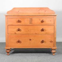 A pine chest of drawers, with a gallery back, on turned feet 106w x 48d x 95h cm