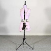 An early 20th century dress maker's dummy, with adjustable body, on a metal base, 150cm high