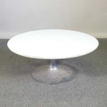 A mid 20th century Arkana tulip coffee table, with a white circular top, on a weighted metal base,
