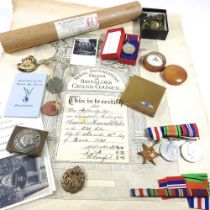 A group of three World War II medals, together with a collection of military items, to include