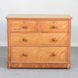 A Victorian maple chest of drawers, together with a Victorian upholstered armchair (2) 104w x 50d
