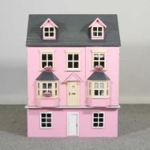 A pink painted doll's house 62w x 44d x 62h cm