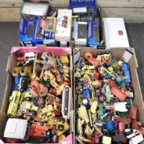 A large collection of die cast toy vehicles, mainly farming related, some boxed