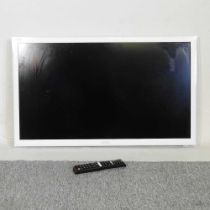 A white Samsung 31 inch television, with remote control