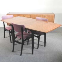 A 1970's Nathan dining suite, comprising an extending dining table, with three dining chairs and a