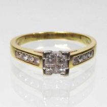 An 18 carat gold diamond ring, with diamond shoulders, 3.6g, size M