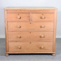 A large Victorian stripped pine chest of drawers, on turned feet 122w x 54d x 116h cm